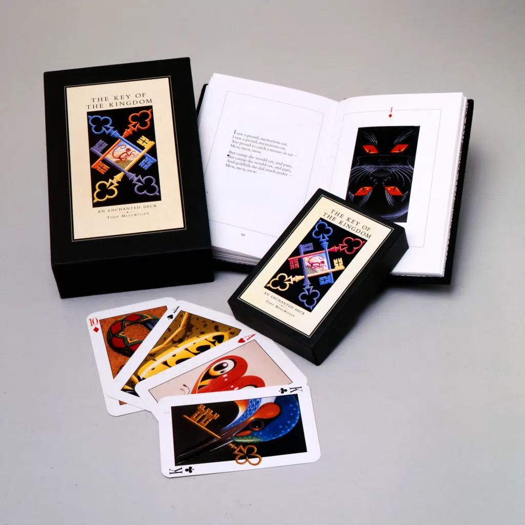 Photo of a book and a pack of cards