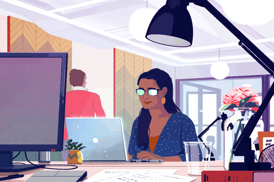 an illustrator is sat at her desk